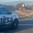A burning vehicle left behind on Campus Loop Road
